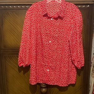 Ladies red blouse with 3/4 elastic at the bottom sleeves.